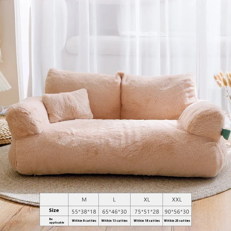 A plush cat sofa bed in blush pink with soft fuzzy fabric and rounded armrests designed as a warm winter pet lounger.