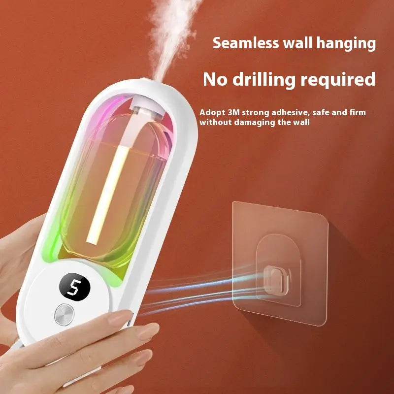 White cylindrical digital aroma diffuser automatic air freshener lamp with transparent water tank containing colorful liquid and illuminated digital display showing number 5.