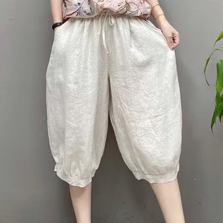 pantalones capri de lino estilo harén de talla grande color crema con ajuste holgado, pretina ajustable con cordón y puños elásticos.