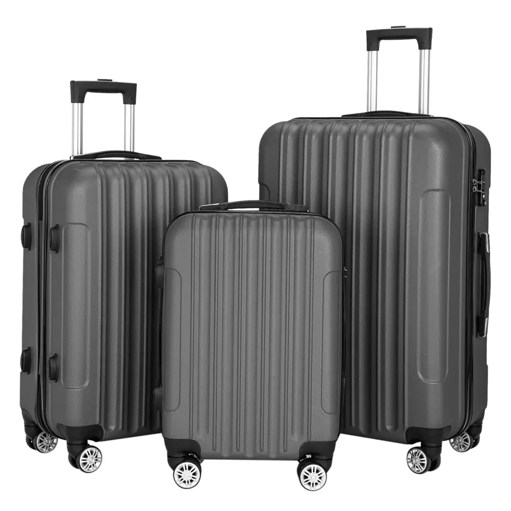 Set of three dark gray hard-shell spinner suitcases with vertical ribbed design and black wheels in a 3-in-1 luggage set.