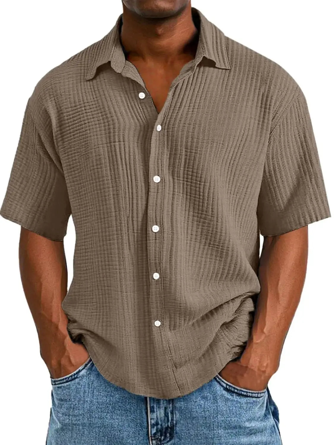 A men’s textured short sleeve button up shirt in muted olive green fabric with vertical ridges and white buttons.