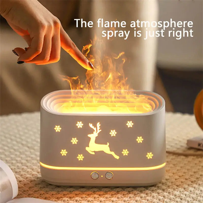 A sleek light gray ceramic Elk Flame humidifier with a glowing reindeer and snowflake design on the front panel for Christmas aromatherapy.