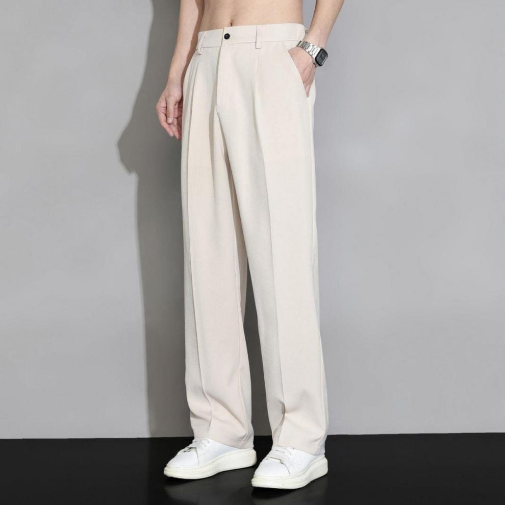 men loose fit straight leg suit pants in cream color featuring a clean minimalist design with subtle pleats at the waist and wide-leg cut