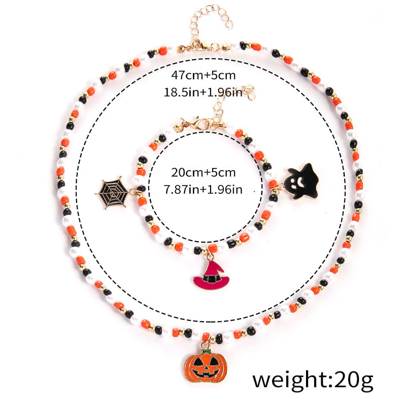 Halloween ghost and pumpkin beaded jewelry set featuring orange black and white beads with gold-tone hardware and themed charms including a pumpkin witch hat ghost and spiderweb.