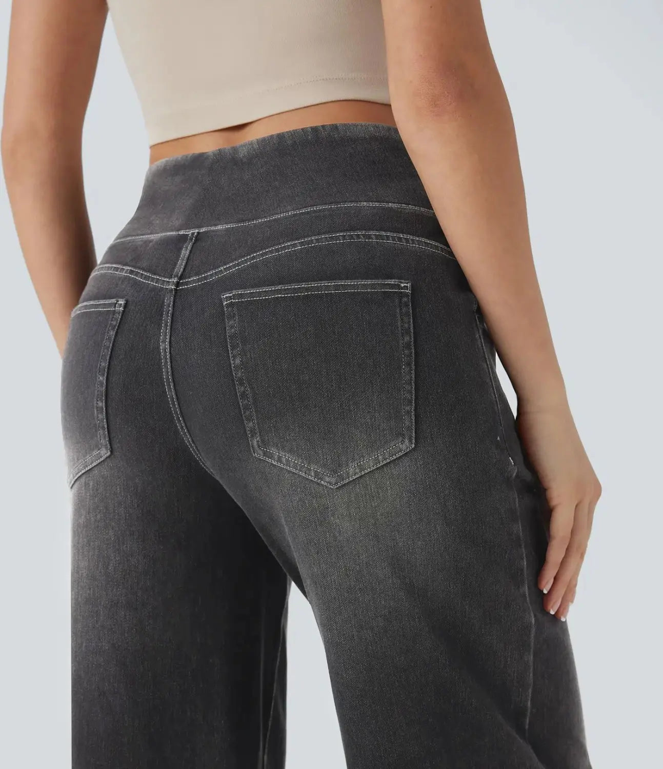 high-waisted wide leg stretchy dark gray denim jeans with a relaxed fit shown from the back with classic back pockets