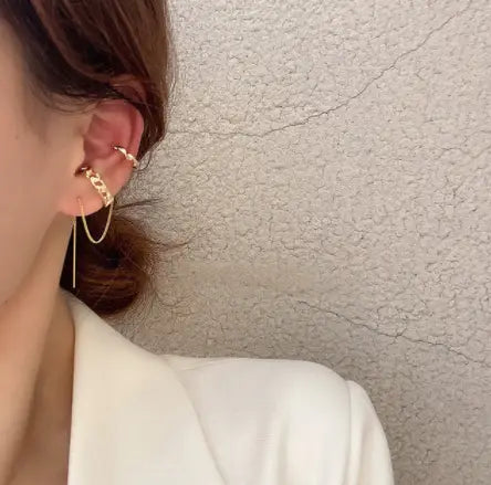 Gold-toned chain ear cuff with a dangling drop element from the butterfly and diamond alloy earring and ear cuff set.
