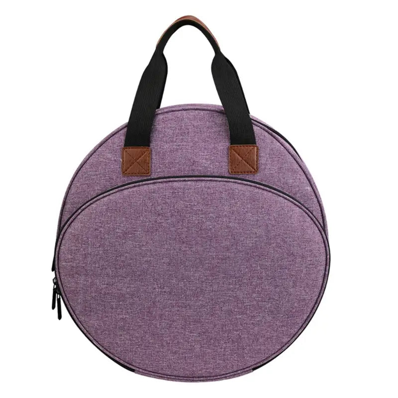 Premium circular embroidery and craft tool storage tote in purple fabric with black handles and brown leather accents.