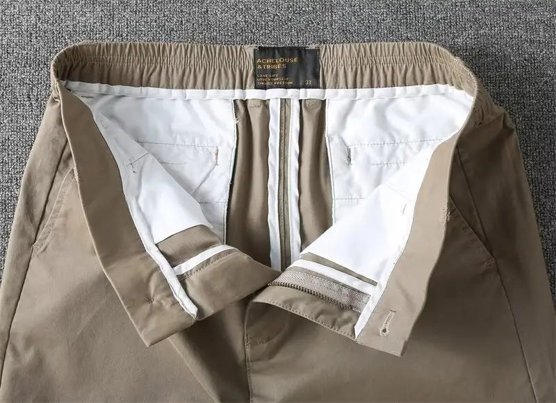 Men casual slim fit cargo shorts in beige khaki with white inner lining and striped cuffs.