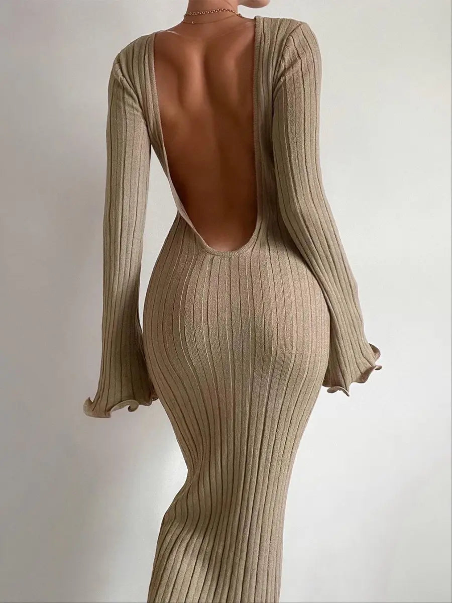 back view of a beige ribbed knit bodycon maxi dress featuring a backless design and flared long sleeves.