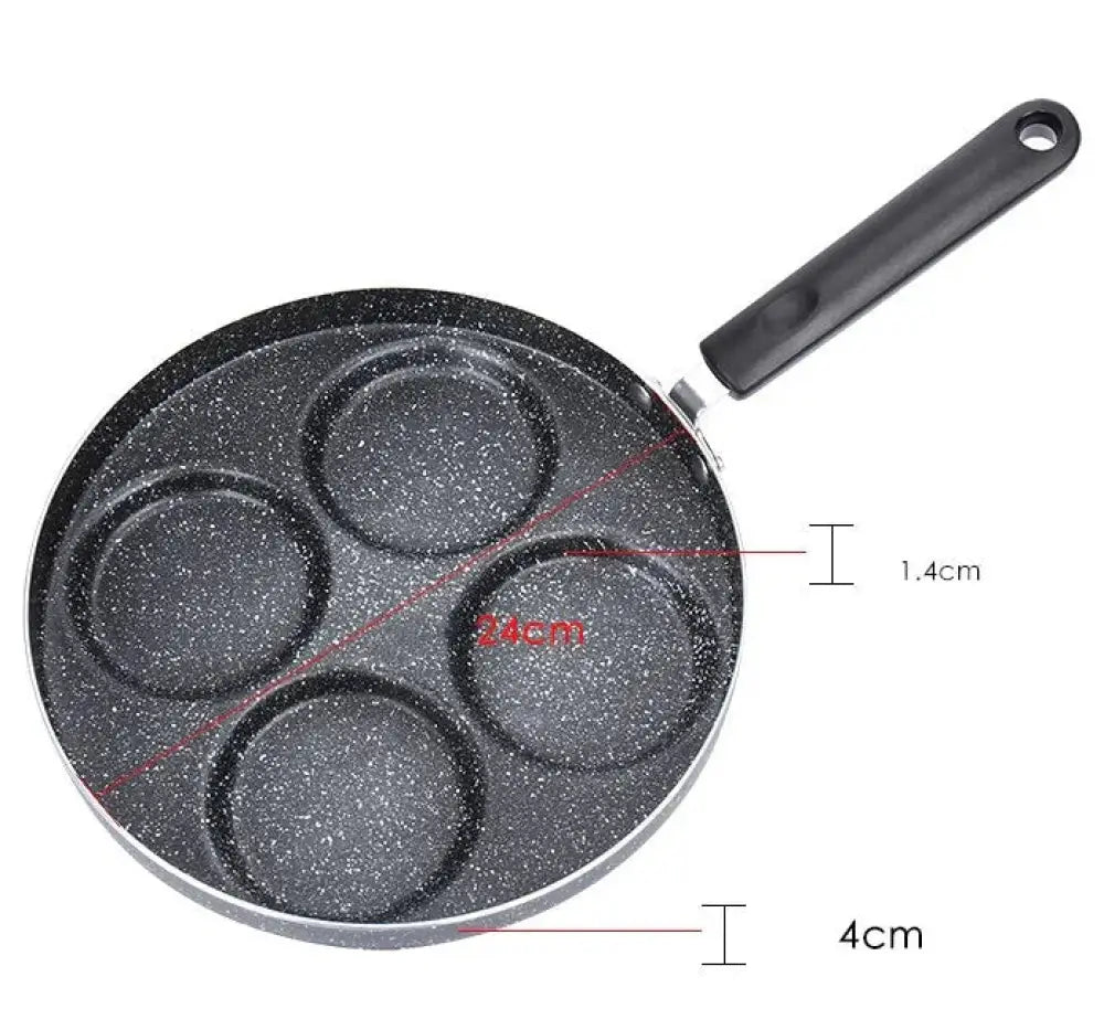 Black speckled nonstick 4 cup egg and pancake pan with four circular indentations and black handle for breakfast use