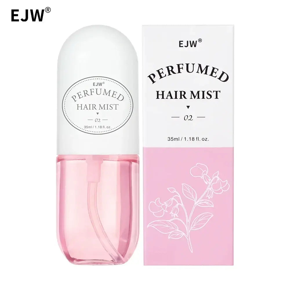Ejw perfumed hair mist and essential oil spray in white and transparent bottle with pink liquid beside pink floral box