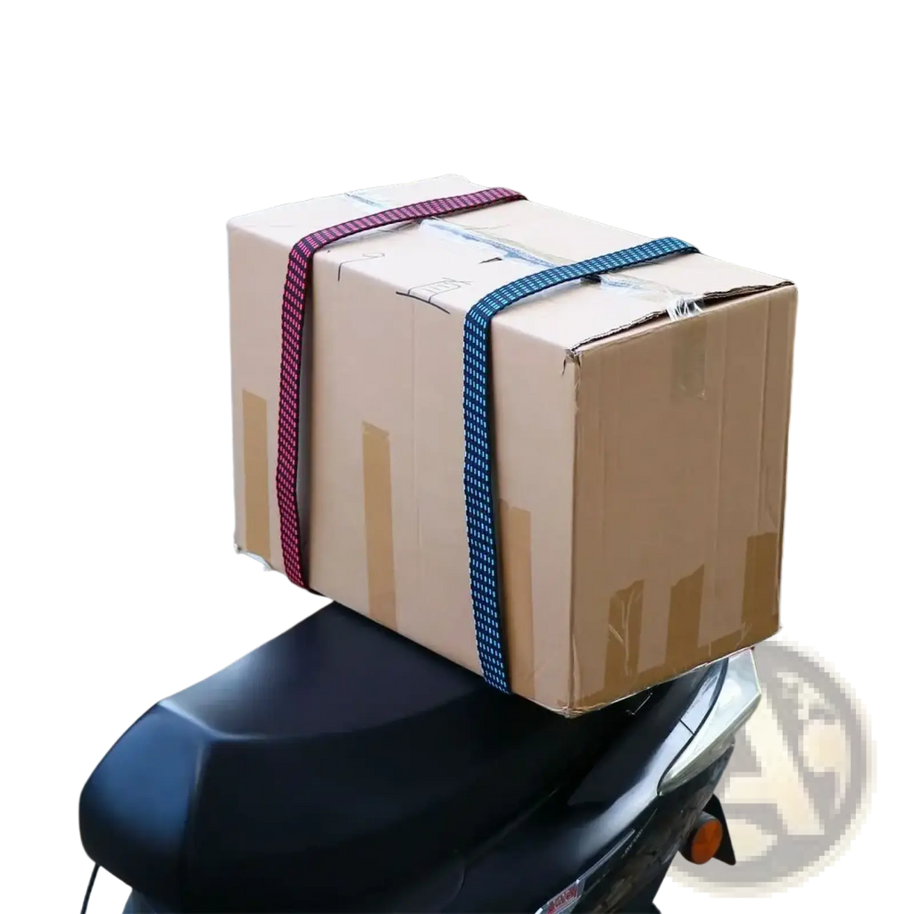 A brown cardboard box secured with red and blue elastic bicycle luggage straps with hooks on a scooter