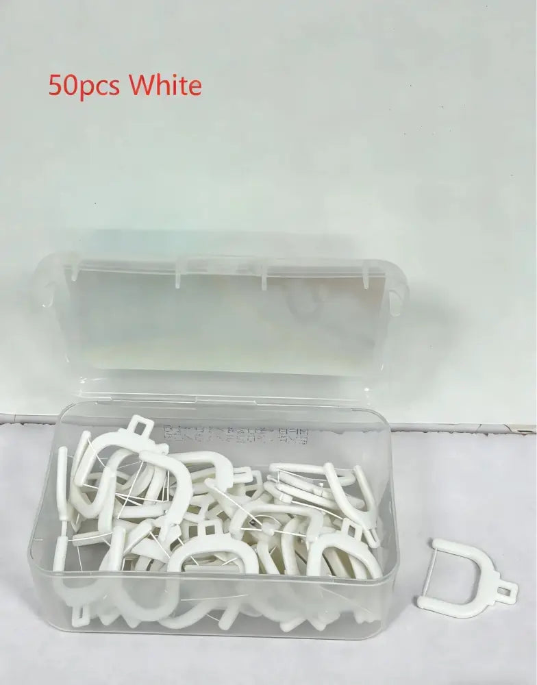 A clear plastic container holds 50 white u-shaped dental interproximal brushes for professional electric water flosser use