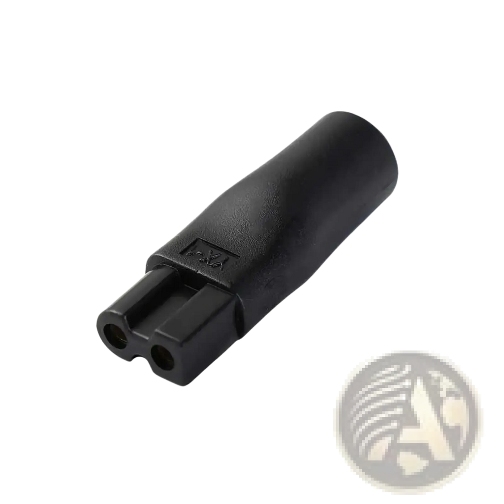 Black plastic electrical plug adapter with two circular openings and textured surface for electric shaver usb charging set