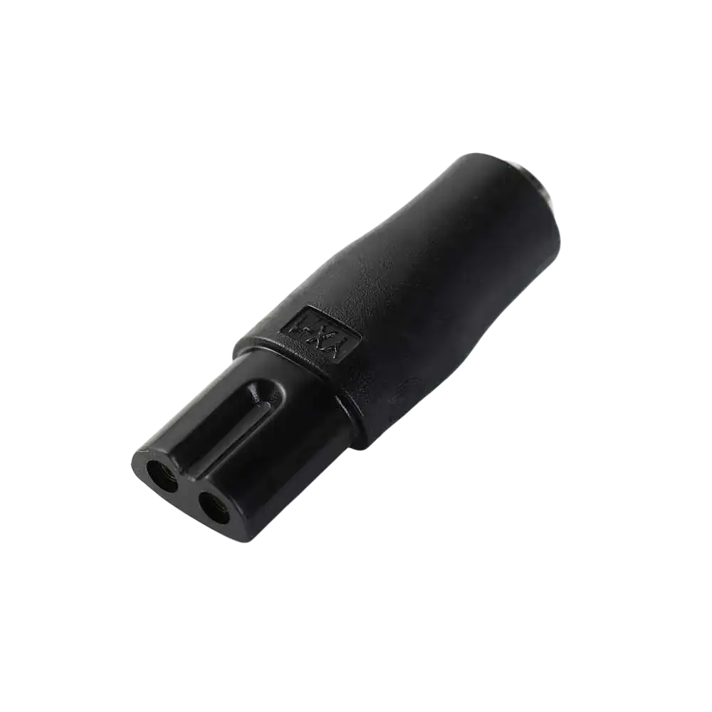 Black plastic electrical plug adapter with two circular openings and i-xx marking for electric shaver usb charging cable set
