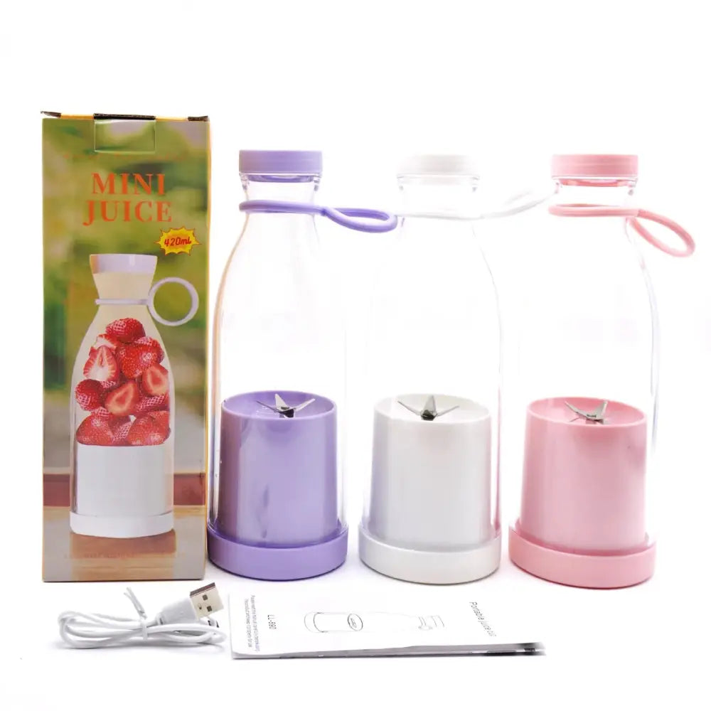 Three colorful portable usb rechargeable personal blenders with transparent glass bottles and matching lids for juicing