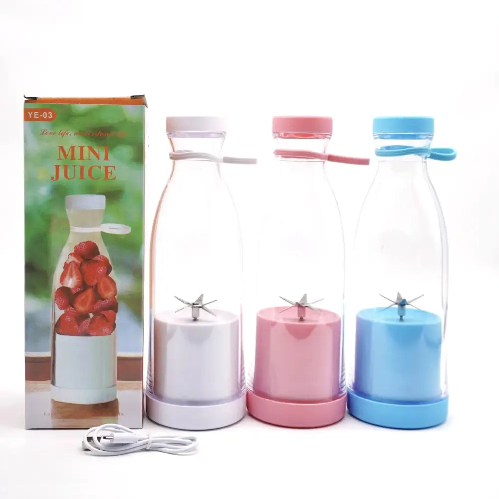 Three colorful mini portable usb rechargeable personal blenders with clear glass bottles and matching colored bases