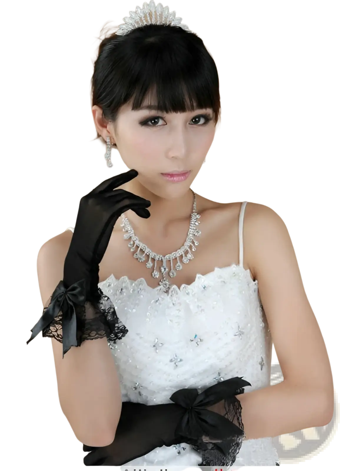 A woman wears elegant black lace and satin bow evening gloves with delicate lace cuffs and a white beaded wedding dress