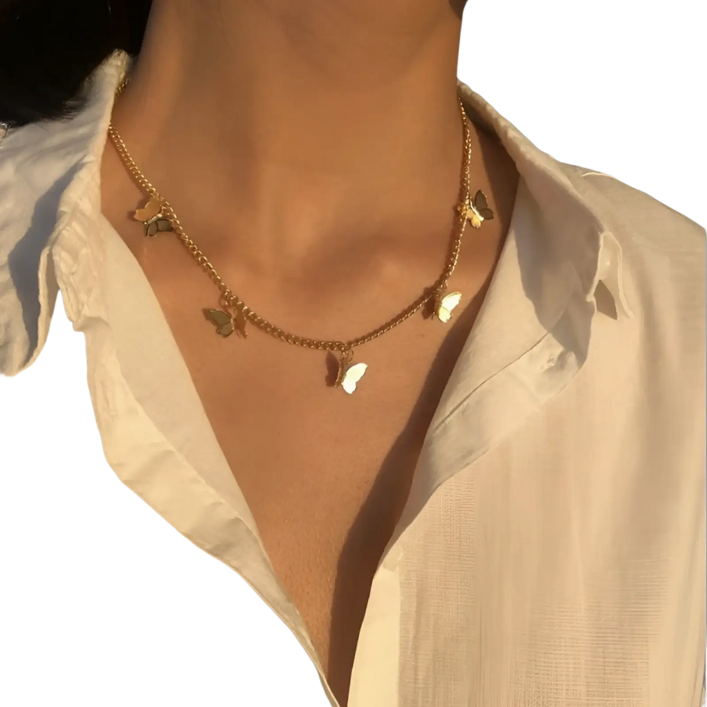 Elegant butterfly charm choker necklace in gold and silver with gold-toned butterflies and delicate metallic chain