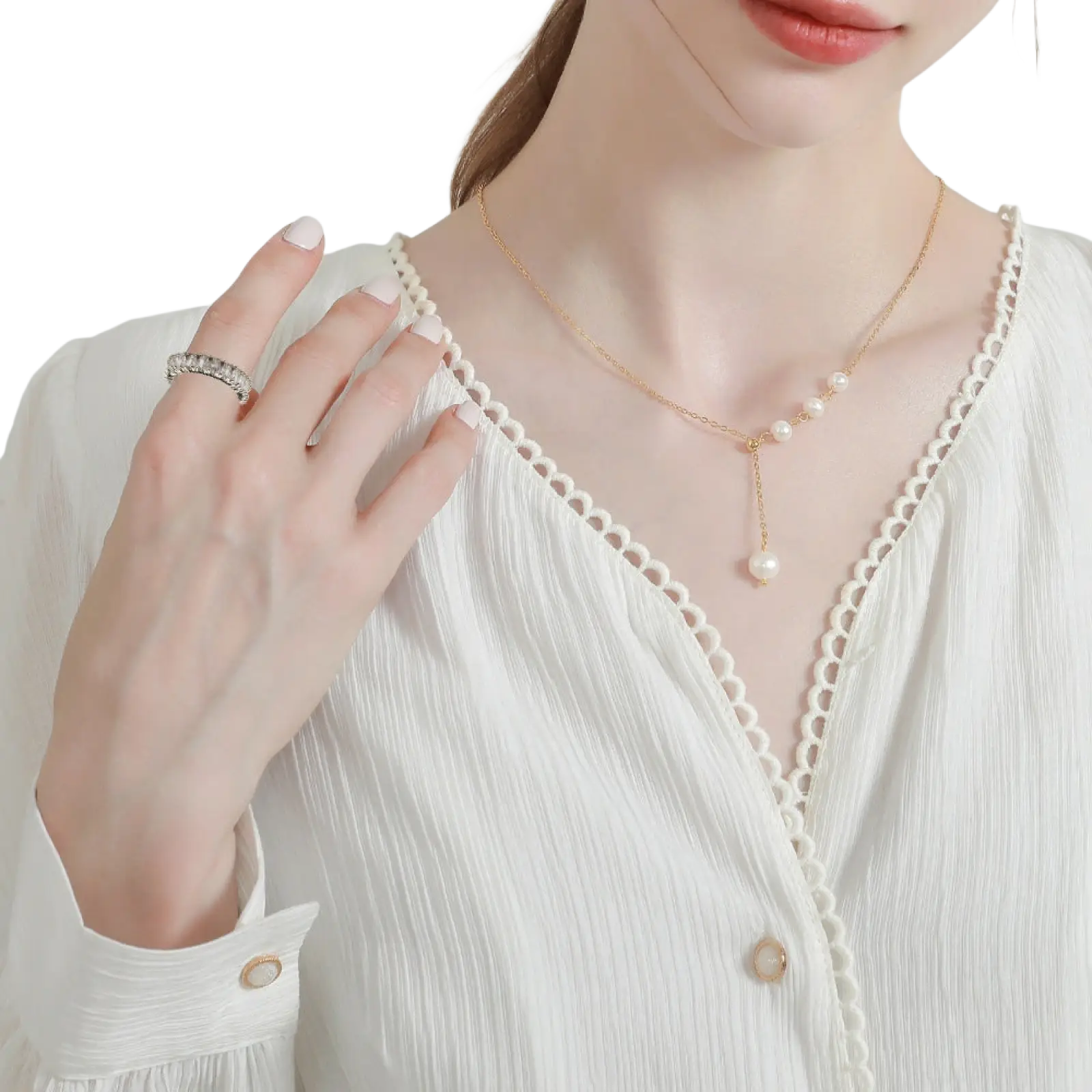 A delicate gold chain necklace from Elegant Eternity featuring small pearls and a larger dangling pearl pendant