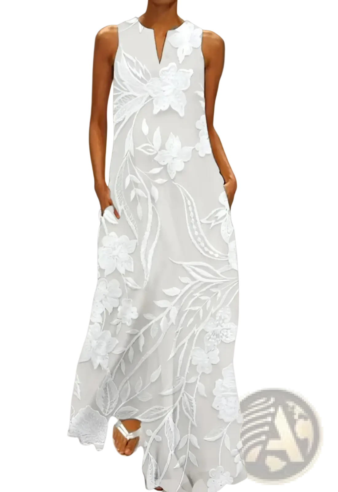 A flowing white sleeveless maxi dress with intricate floral lace appliqué and delicate embroidery detailing