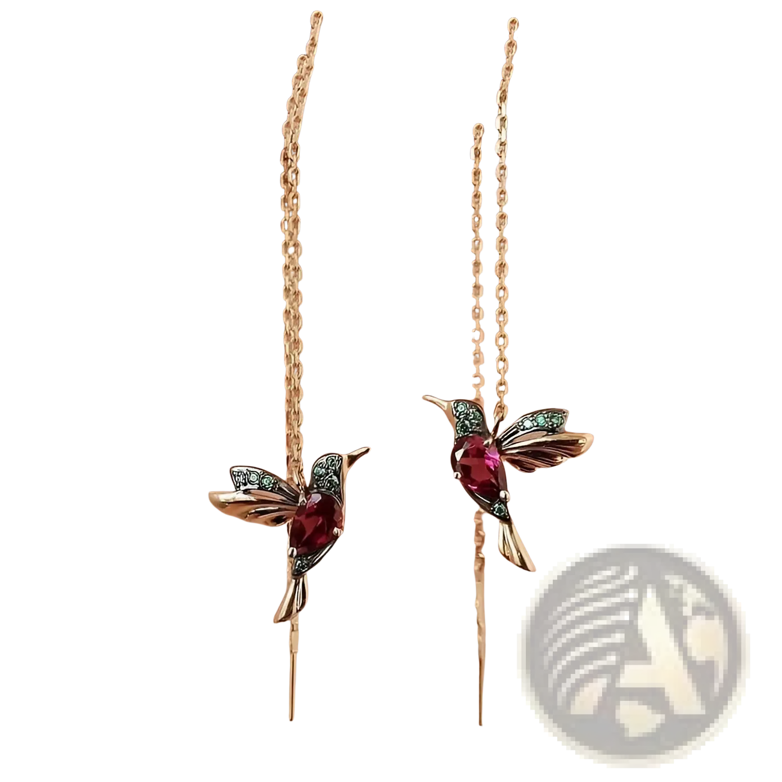 Delicate gold-toned hummingbird ear cuffs with central ruby-red gemstone and green accents for elegant wear