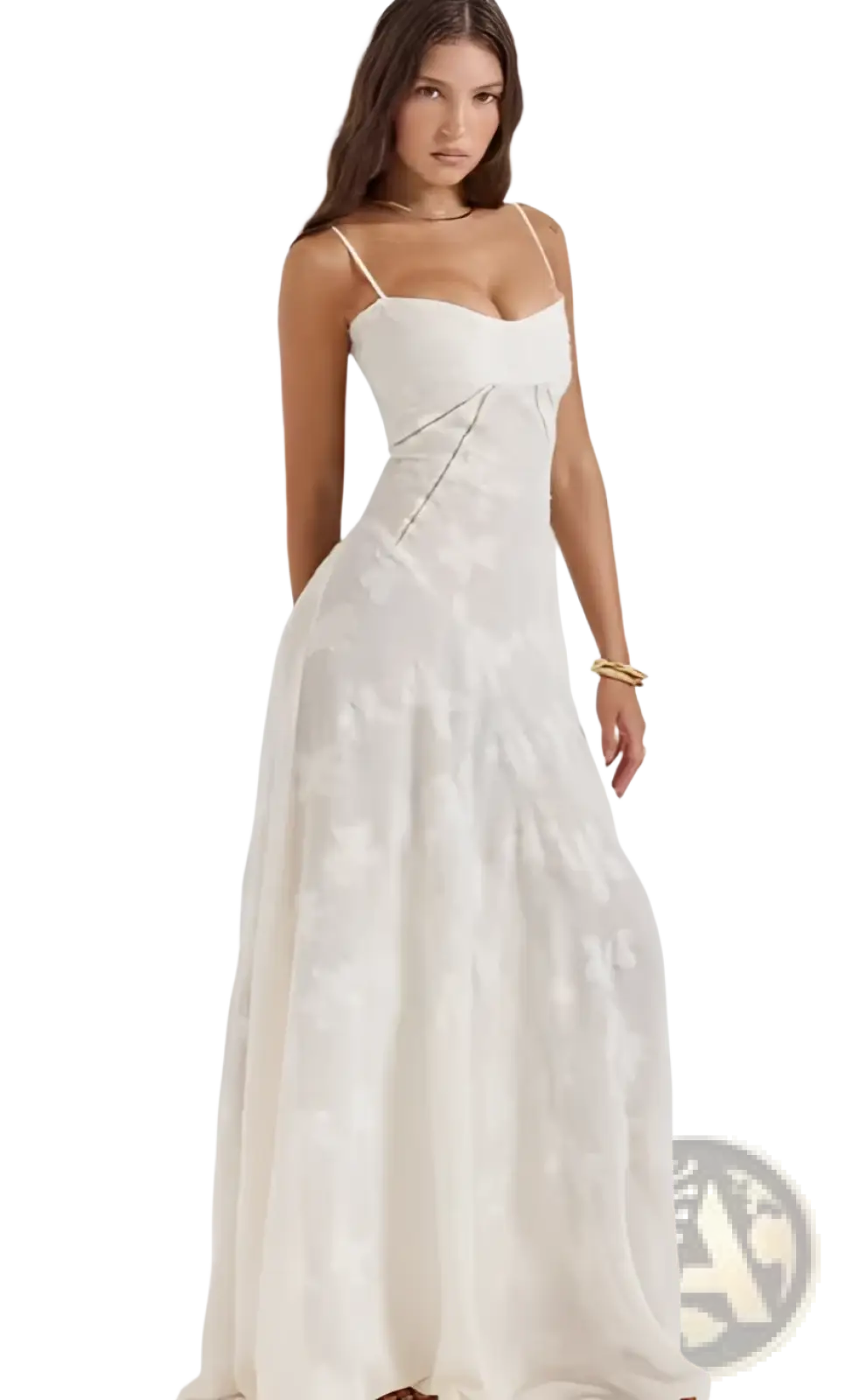 A flowing white lace embroidery maxi dress with delicate floral designs and thin spaghetti straps