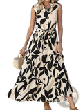 Beige and black leaf-patterned sleeveless button-down midi dress with a tiered skirt for elegant occasions
