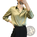 A sleek olive green satin blouse with a classic button-down front and rolled-up long sleeves made of silk