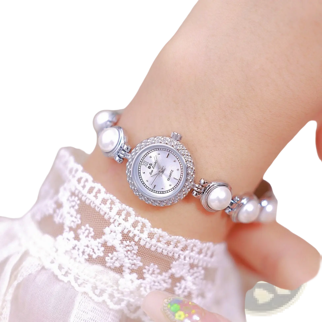 Elegant pearl bracelet quartz watch for women featuring silver pearl-adorned quartz face and sparkling bezel with delicate bracelet