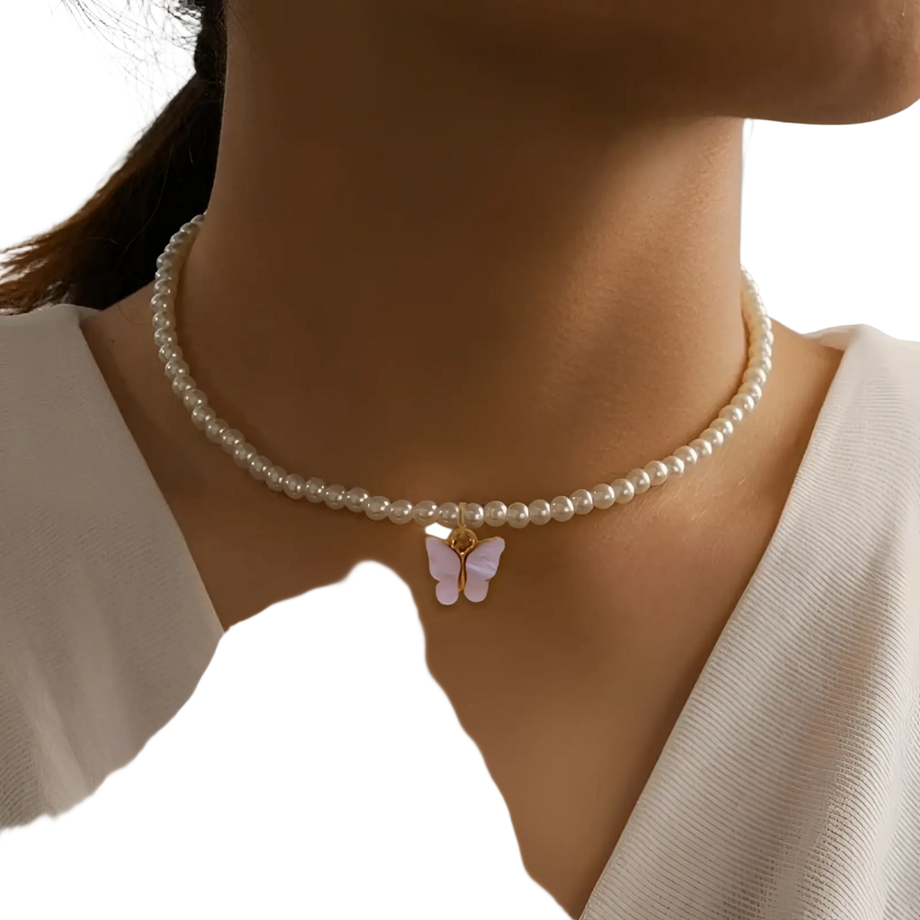 Elegant pearl butterfly charm choker necklace with a delicate pearl chain and a soft lavender butterfly pendant