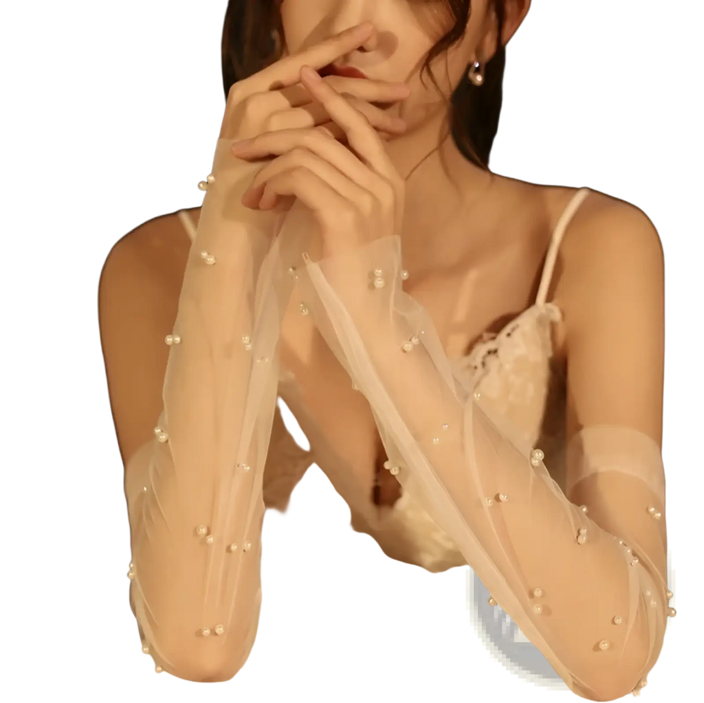 Elegant white sheer mesh bridal gloves adorned with scattered pearl-like beads showcasing delicate embellishments