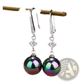 Elegant pearl and pave diamond drop earrings featuring silver dangle design with sparkling pave and peacock green pearls