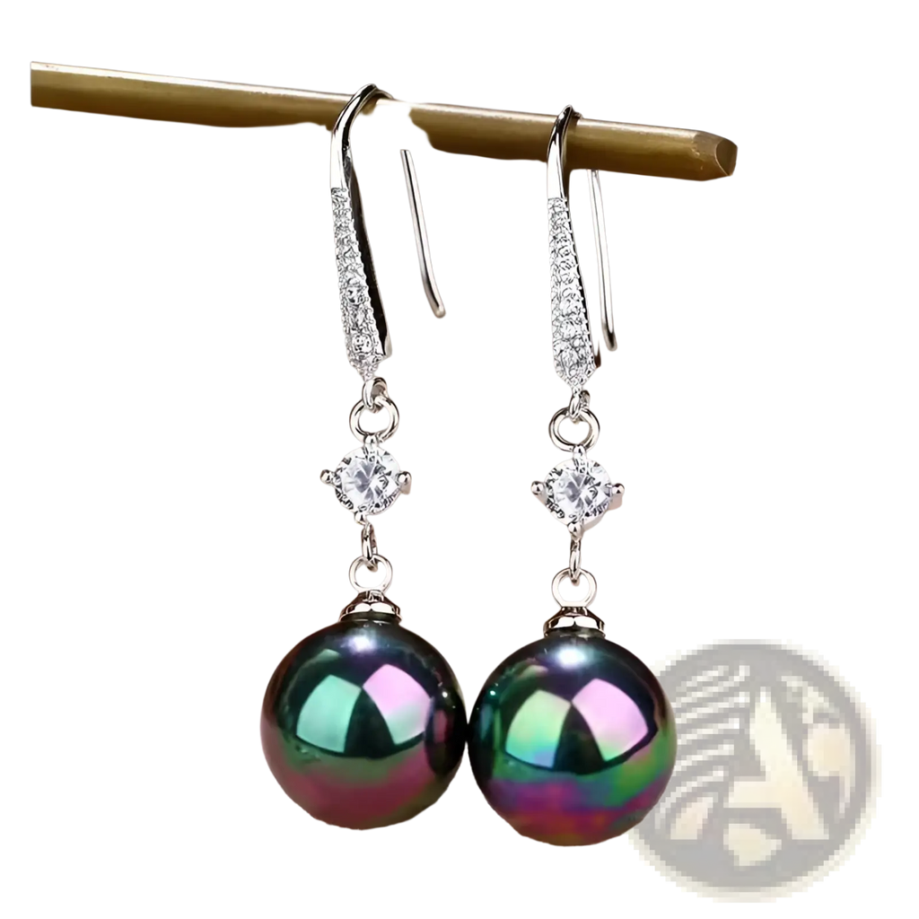 Elegant pearl and pave diamond drop earrings featuring silver hooks with sparkling diamonds and a peacock green pearl
