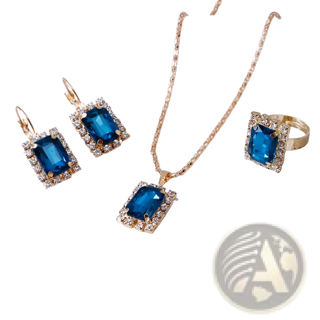 A gold-toned three piece jewelry set with matching earrings necklace and ring featuring blue rectangular gemstones surrounded by clear crystals