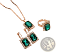 Elegant rectangular gemstone gold jewelry three piece set featuring emerald green stones with rose gold and diamond accents