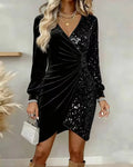 Black velvet and sequined long sleeve wrap dress with draped front detail for elegant evening wear