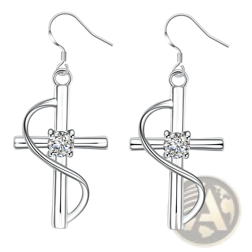 Elegant silver swirling cross earrings featuring a central clear gemstone and intricate metalwork design