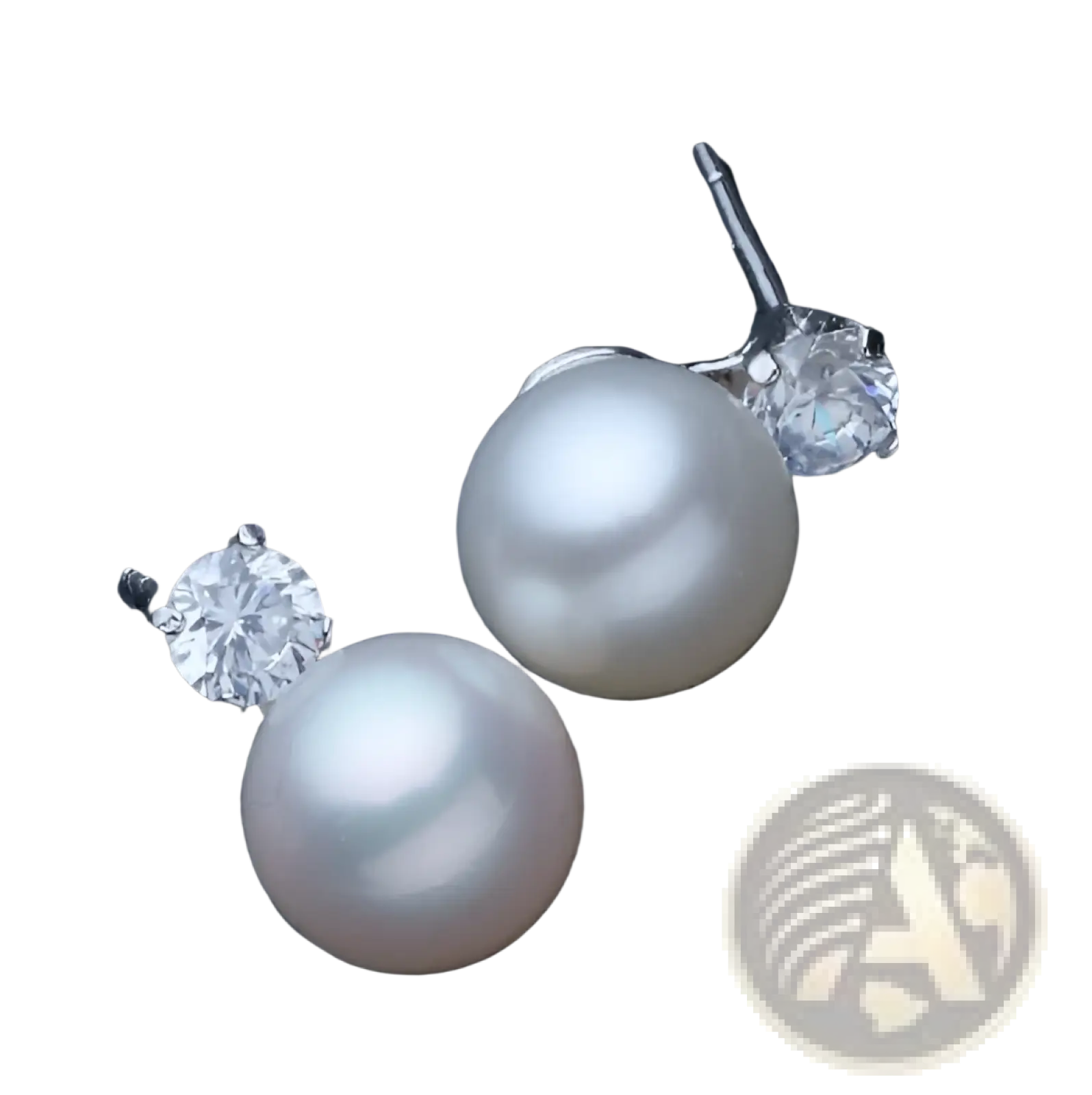 Elegant white pearl and cubic zirconia silver stud earrings featuring lustrous freshwater pearls and sparkling stones