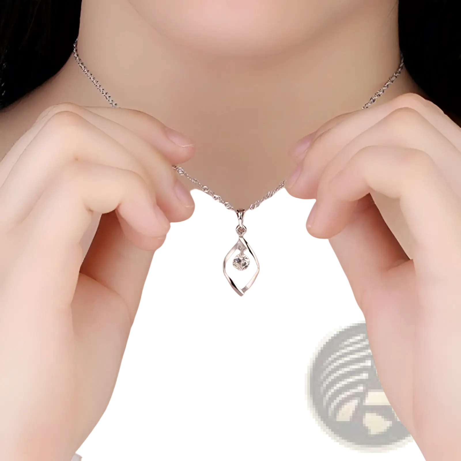 A delicate silver necklace with a swirling diamond-encrusted zircon twist teardrop pendant