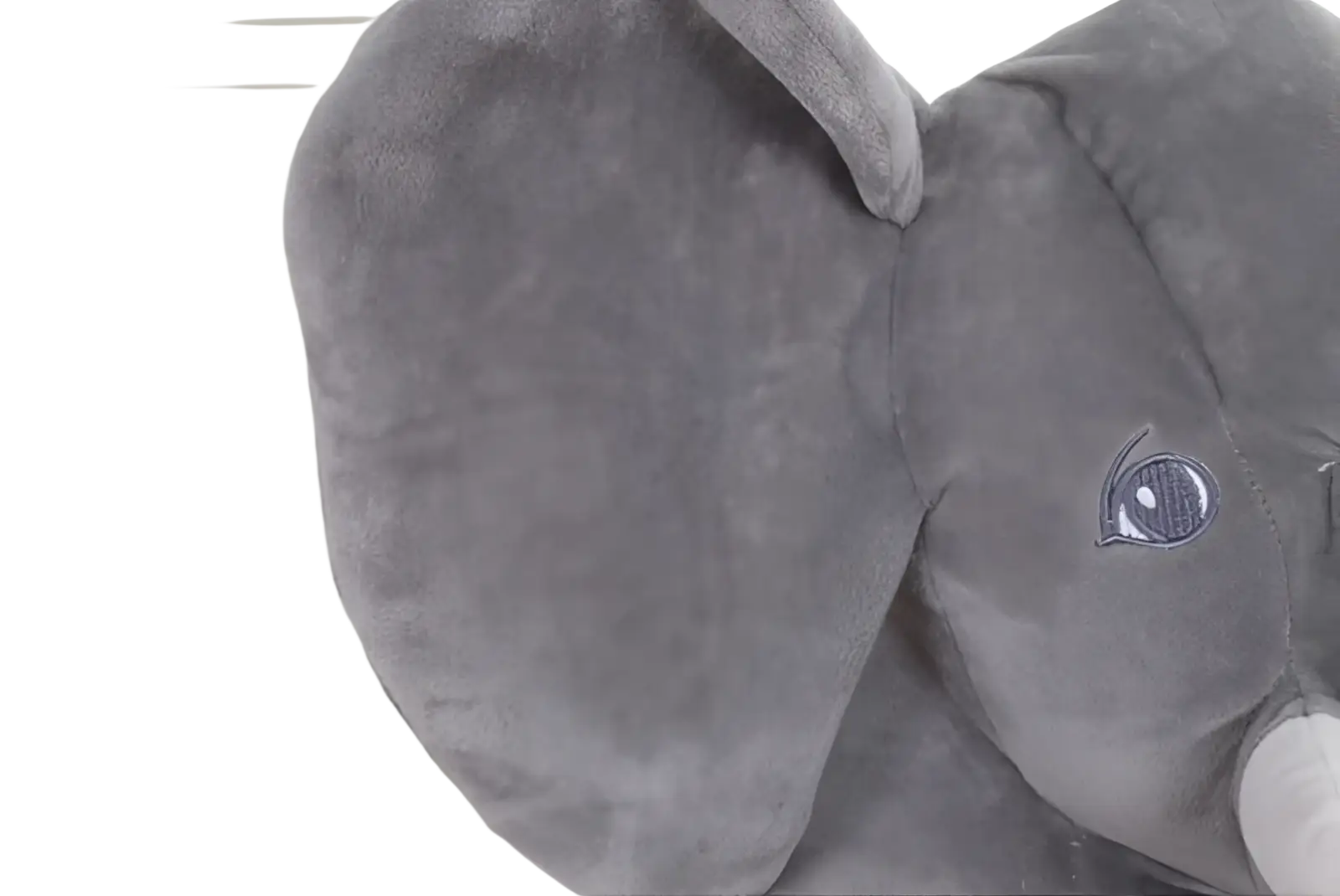 A plush gray elephant toy with soft velvety fabric and embroidered eyes ideal as a kids stuffed animal pillow