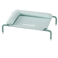 A mint green fabric elevated dog bed with padded headrest and metal frame by helloleiboo for comfort and support