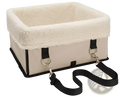 Beige elevated dog car seat with plush white fleece lining and black webbing straps for portable waterproof use