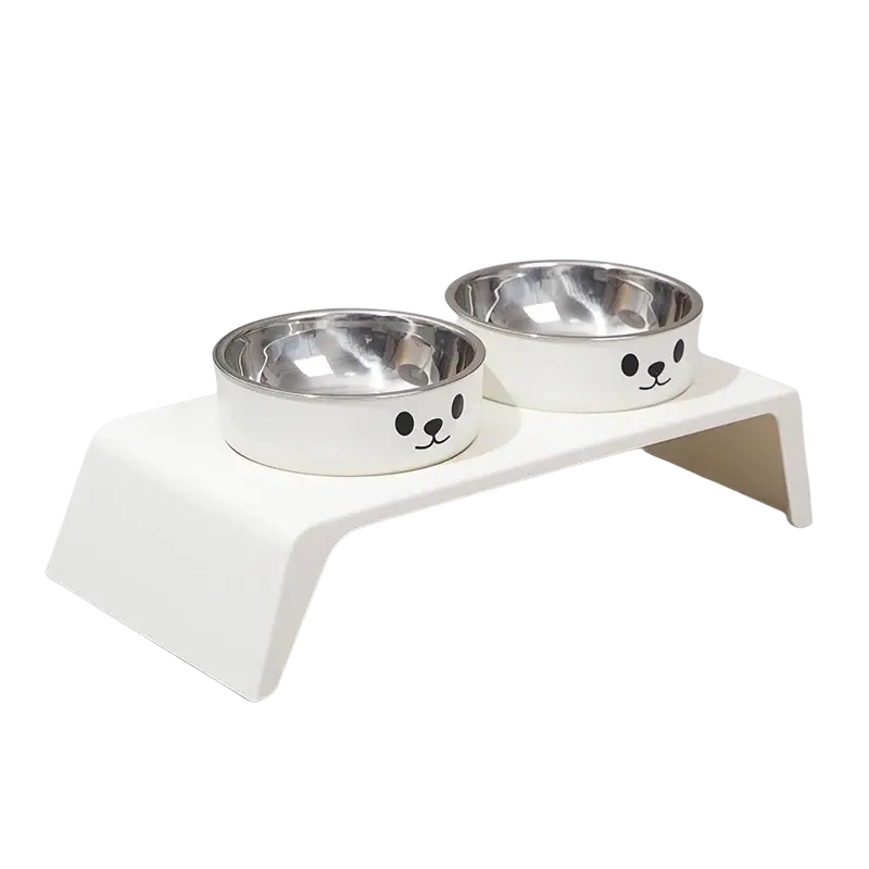 White cat-faced elevated dog feeder with raised stand and two stainless steel bowls for pet feeding