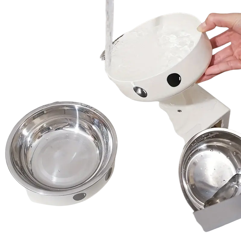 White plastic pet bowl with black circular eyes and silver metallic accents in elevated dog feeder with stainless steel bowls