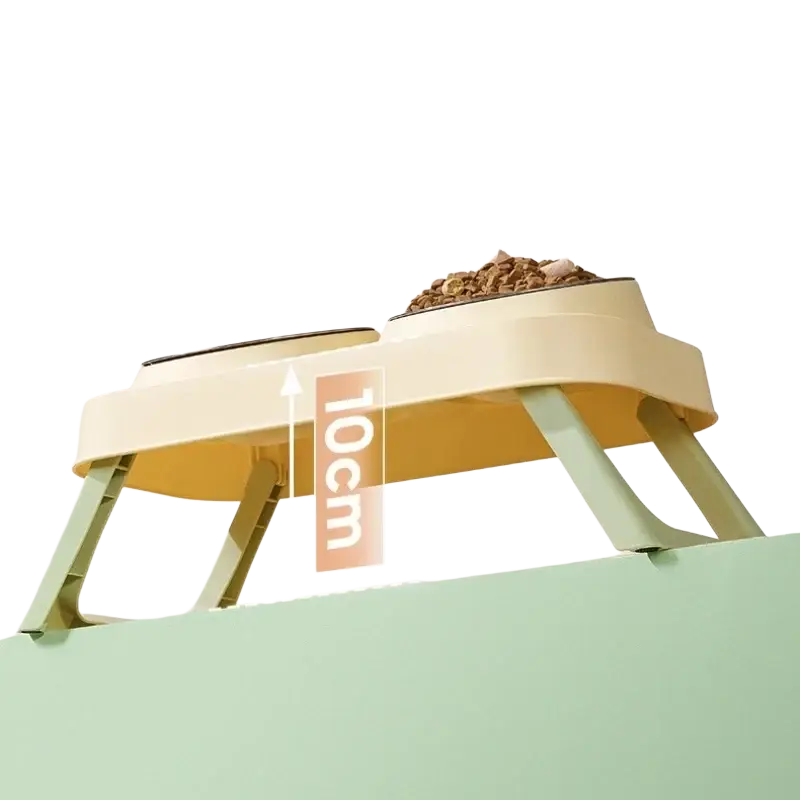Elevated stainless steel pet feeder with beige and mint green plastic frame and two tilt bowls for feeding