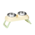 Elevated cream-colored plastic pet feeder with two stainless steel tilt bowls for improved feeding ergonomics