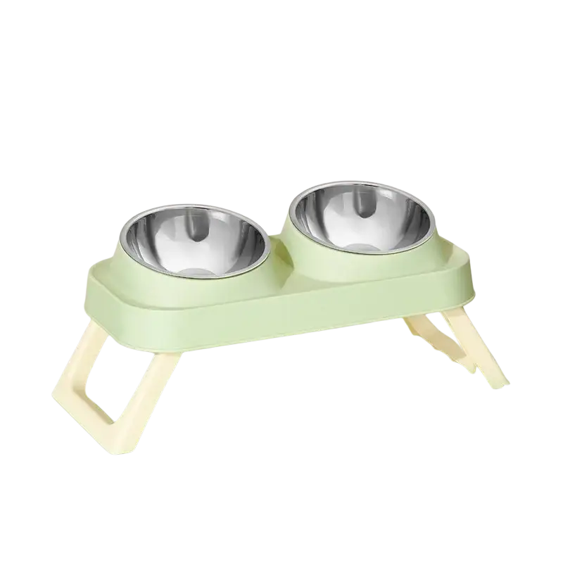 Elevated pet feeder with light green plastic frame, cream legs, and two stainless steel tilt bowls for feeding