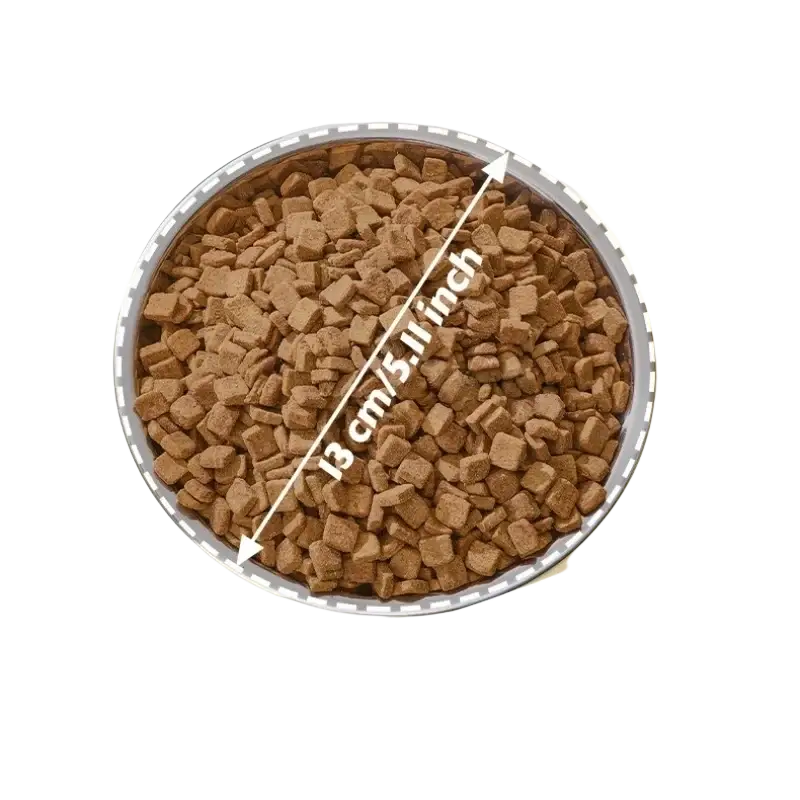 Elevated stainless steel pet feeder with a round silver-rimmed tilted bowl filled with brown kibble