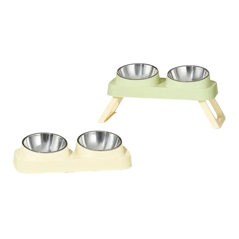 Set of two pastel green and cream elevated pet feeders with stainless steel tilt bowls for comfortable feeding